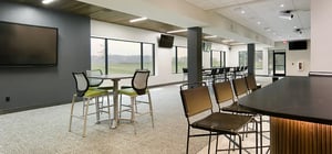 Modern country club golf simulation lounge