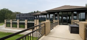 Modern country club exterior pathway to building