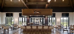 Modern country club dining room with feature bar area