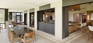 Modern country club dining area with wood beam features