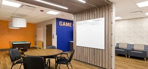 Modern game lounge area for community engagement with vibrant colors