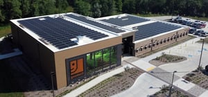 Exterior shot of modern goodwill community center featuring solar panels