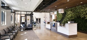Modern entry receptionist area with faux plant feature wall