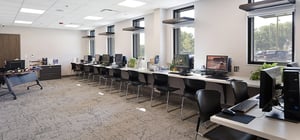 Community media lab with new computers against a wall.