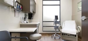 Modern healthcare clinic exam room with natural light and minimalist decor