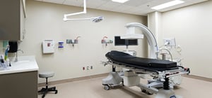 Modern healthcare clinic procedure room with medical equipment