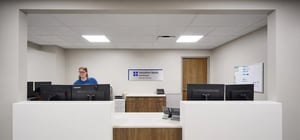 Healthcare reception desk with nurse