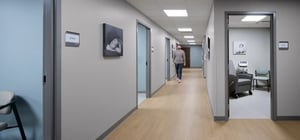 Midwife services corridor with man walking through