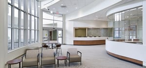 ER entry corridor with receptionist desks and waiting area