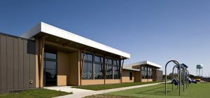 Exterior shot of elementary school with playground