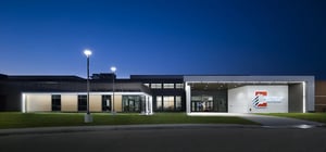 Modern elementary school exterior entrance at dusk