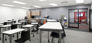 Modern high school classroom with varied height desks.