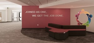 Architectural rendering of a modern elementary school entryway commons mural wall