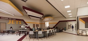 Architectural rendering of an elementary school commons area with seating